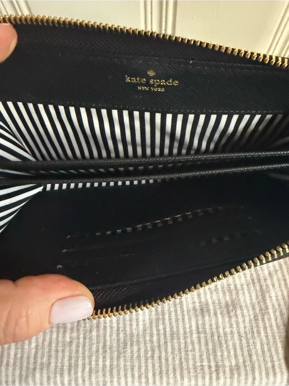 kate spade black zip-around wristlet wallet with gold logo